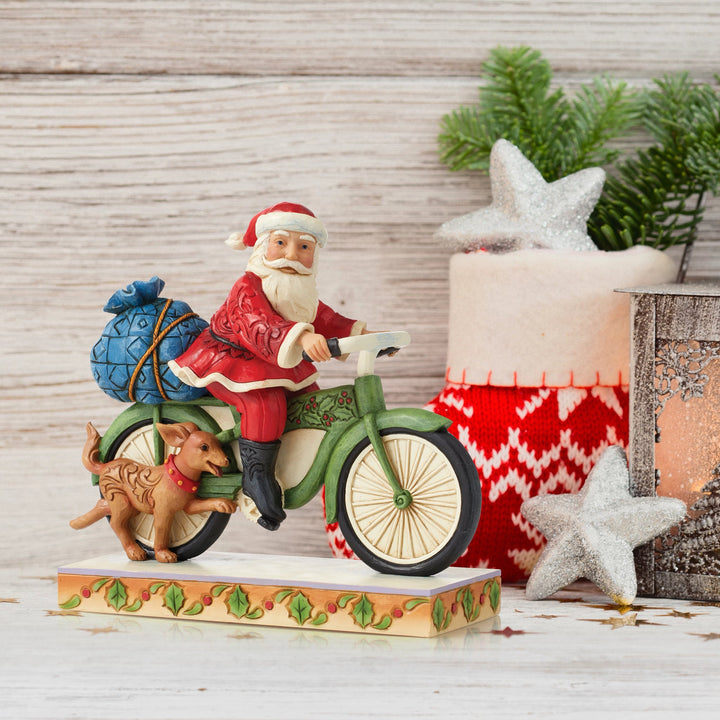 Jim Shore - Heartwood creek 'Santa riding Bike Figurine - Santa auf dem Fahrrad' 2022-6010818